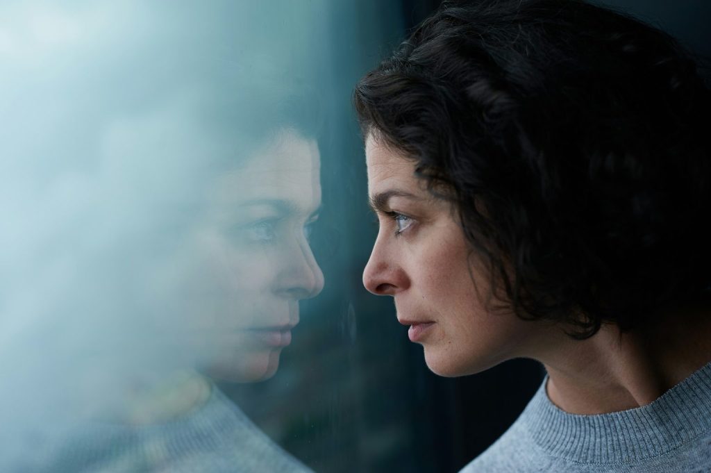 Woman looking at her reflection